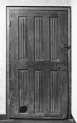 A door with a cat hole dating from around 1450-1500.
