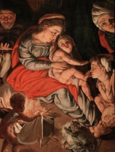 A painting of the Holy Family with their cat.