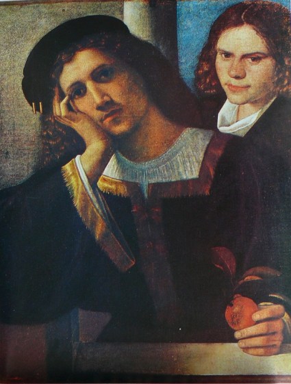 A very handsome and sad-faced young man sitting at a table and holding a piece of fruit that he shows no interest in eating, in one hand. Behind him stands a youth with a slightly mocking smile. 