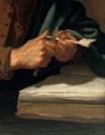 A quill being trimmed with a small knife.