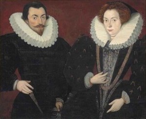 A man and woman in full Elizabethan dress with impressively large white ruffs.