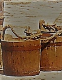 Two wooden buckets with handles made of rope.