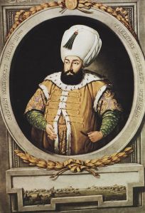 The imposing figure of a dark-bearded man wearing a very large white turban.