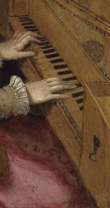 A woman's hands on the keys of a spinet.